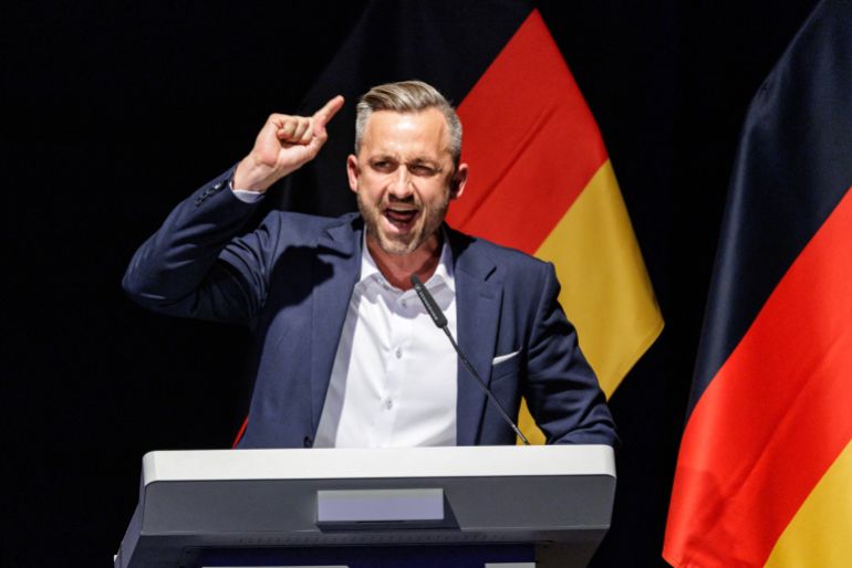 afp_6a93d5770407-1788073335 Ulrich Siegmund, far-right Alternative for Germany (AfD)'s main candidate in the Saxony-Anhalt state election, speaks to delegates during the federal congress of Generation Germany, the youth organization of the far-right Alternative for Germany (AfD) party, in Magdeburg, eastern Germany, on August 29, 2026. (Photo by Jens SCHLÜTER / AFP)