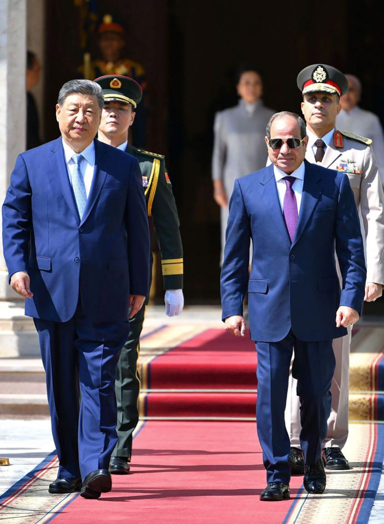 afp_6a99198da44f-1788418445 This handout photograph released by the Egyptian Presidency on September 2, 2026 shows China's President Xi Jinping (L) walking along with his Egyptian counterpart Abdel Fattah al-Sisi during his welcome ceremony at the Ittihadia Presidential Palace in Cairo.