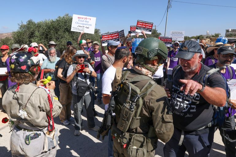 afp_6a9af84ce122-1788541004 Israeli forces block peace activists carrying food and water from reaching Palestinian families whose homes have been cut off supplies by Israeli settlers in the village of Qusra, south of the city of Nablus in the Israeli-occupied West Bank, on September 4, 2026.