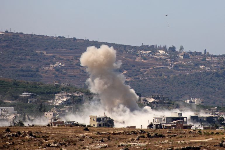 This photograph taken from the southern Lebanese village of al-Hanniyeh shows an Israeli drone carrying explosives to be dropped at the site of a controlled explosion in al-Mansouri village, on September 9, 2026.