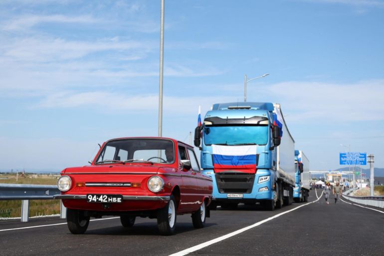 In this handout image released by the Russian Transport Ministry on September 7, 2026, Russian trucks and a Zaporozhets car cross the new Russia-North Korea road bridge over the Tumen River, during the opening ceremony. (Photo by Handout / Russian Transport Ministry / AFP) / RESTRICTED TO EDITORIAL USE - MANDATORY CREDIT "AFP PHOTO / RUSSIAN TRANSPORT MINISTRY" - HANDOUT - NO MARKETING NO ADVERTISING CAMPAIGNS - DISTRIBUTED AS A SERVICE TO CLIENTS