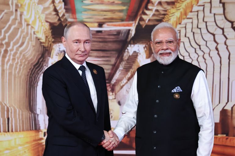 afp_6aa527f82612-1789208568 In this pool photograph distributed by the Russian state agency Sputnik, Russia's President Vladimir Putin (L) and India's Prime Minister Narendra Modi shake hands at the official welcoming ceremony for BRICS heads of state in New Delhi on September 12, 2026. (Photo by Alexander KAZAKOV / POOL / AFP) / ***EDITOR'S NOTE : THIS IMAGE IS DISTRIBUTED BY THE RUSSIAN STATE OWNED AGENCY SPUTNIK***