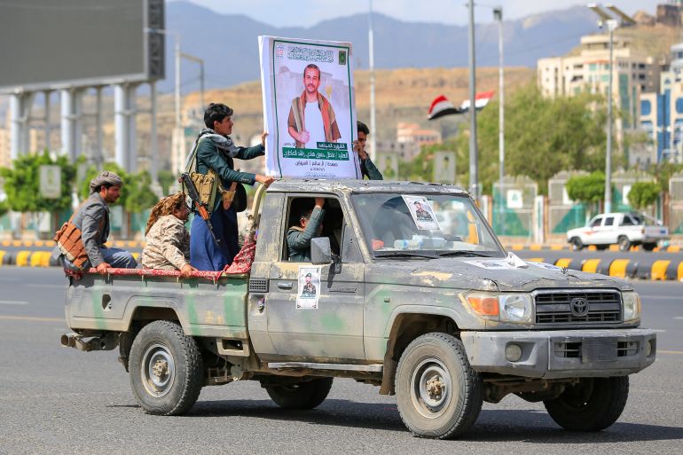 afp_6aafea3a0aaa-1789913658 A pickup truck with a portrait of a fighter loyal to the Houthi authorities drives past during his funeral after he was killed in recent fighting, in Yemen's capital Sanaa on September 17, 2026.