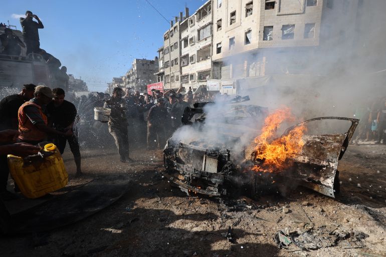 afp_6ab0d3d58a99-1789973461-1 Palestinians attempt to extinguish a burning vehicle that was struck by an Israeli airstrike in Gaza City on September 19, 2026.