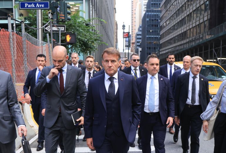 afp_6ab23e504679-1790066256 French President Emmanuel Macron (C) walks with France’s Foreign Affairs Minister Jean-Noël Barrot (L) as they head to Trump Tower in New York City on September 21, 2026, ahead of a meeting with US President Donald Trump. (Photo by Ludovic MARIN / AFP)
