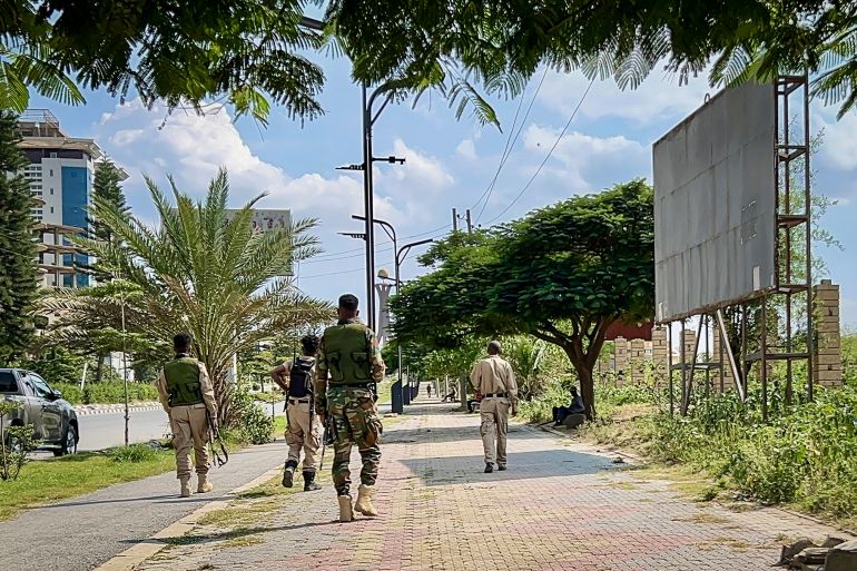 afp_6ab41f4c15b6-1790189388 Members of the Tigray People's Liberation Front (TPLF) walk along a main road in Mekelle on September 23, 2026, as tensions intensify in northern Ethiopia after Tigrayan rebels seized control of airports in the region.