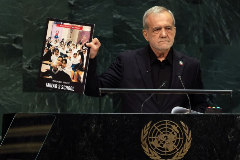 NEW YORK, NEW YORK - SEPTEMBER 23: Iranian President Masoud Pezeshkian holds up a picture of a school that was bombed during Israeli and American airstrikes while the leader speaks during the 81st session of the United Nations (U.N.) General Assembly at U.N. Headquarters on September 23, 2026 in New York City. World leaders have gathered in New York for the annual session of the United Nations General Assembly, with this year's global issues ranging from the threat of artificial intelligence to the continued wars in Ukraine and Gaza. Spencer Platt/Getty Images/AFP (Photo by SPENCER PLATT / GETTY IMAGES NORTH AMERICA / Getty Images via AFP)