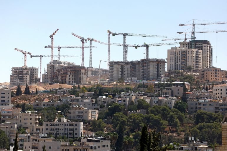 afp_6ab6a5eeb108-1790354926-1 Cranes tower above a construction site in Givat HaMatos, an Israeli settlement and near the Arab neighbourhood of Beit Safafa (foreground) in the annexed east Jerusalem on September 16, 2026. (Photo by AHMAD GHARABLI / AFP)