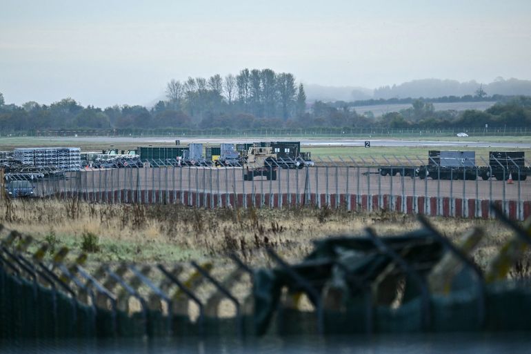 An armoured vehicle (C) patrols the interior at RAF Fairford base in Fairford, south-west England on September 28, 2026, a day after British counter-terrorism police were probing "a major" incident near the base.