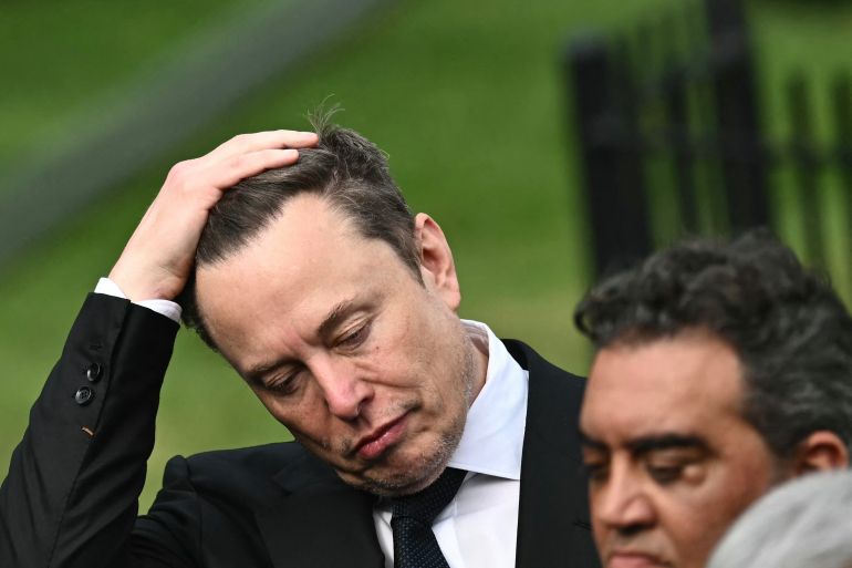 CEO of Tesla and SpaceX Elon Musk reacts as US President Donald Trump speaks to the press after a meeting with technology executives about artificial intelligence at the White House in Washington, DC, on September 29, 2026.