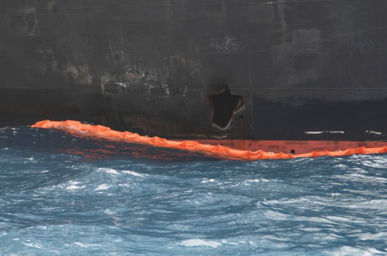 ap19170446664894-1788201683 A hole the U.S. Navy says was made by a limpet mine is seen on the damaged Panama-flagged, Japanese owned oil tanker Kokuka Courageous, anchored off Fujairah, United Arab Emirates, during a trip organized by the Navy for journalists, on a Wednesday, June 19, 2019. The limpet mines used to attack the oil tanker near the Strait of Hormuz bore "a striking resemblance" to similar mines displayed by Iran, a U.S. Navy explosives expert said Wednesday. Iran has denied being involved. (AP Photo/Fay Abuelgasim)