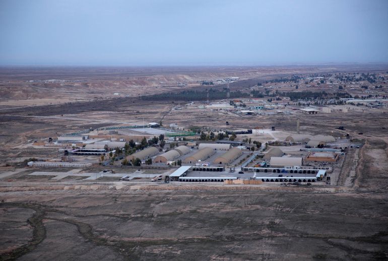 ap21062301935581-1768676012 FILE - This Dec. 29, 2019, aerial file photo taken from a helicopter shows Ain al-Asad air base in the western Anbar desert, Iraq. At least 10 rockets targeted a military base in western Iraq that hosts U.S.-led coalition troops on Wednesday, March 3, 2021, the coalition and the Iraqi military said. It was not immediately known if there were any casualties. (AP Photo/Nasser Nasser, File)