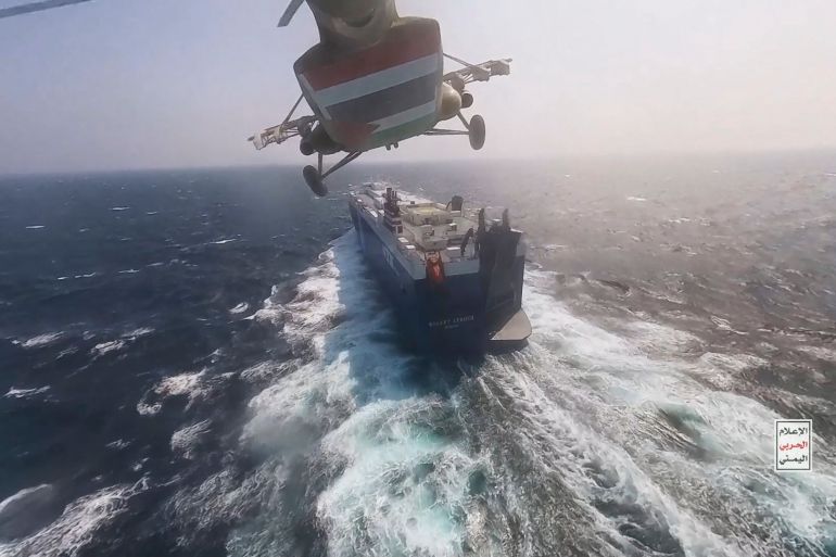 ap_696a74f6a2738-1768584438 This photo released by the Houthi Media Center shows a Houthi forces helicopter approaching the cargo ship Galaxy Leader on Sunday, Nov. 19, 2023. Yemen's Houthis have seized the ship in the Red Sea off the coast of Yemen after threatening to seize all vessels owned by Israeli companies. (Houthi Media Center via AP)