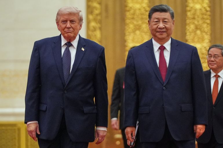 ap_6a8ef4e67b0c6-1787753702 FILE - President Donald Trump, left, and Chinese President Xi Jinping arrive a state dinner at the Great Hall of the People May 14, 2026, in Beijing. (AP Photo/Mark Schiefelbein)
