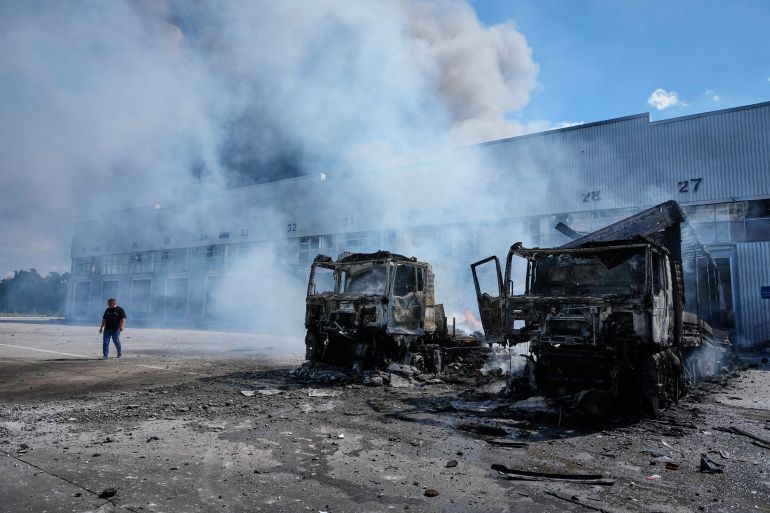 Vehicles burn in front of warehouses following a Russian air attack in Kyiv, Ukraine, Wednesday, Sept. 2, 2026. (AP Photo/Efrem Lukatsky)