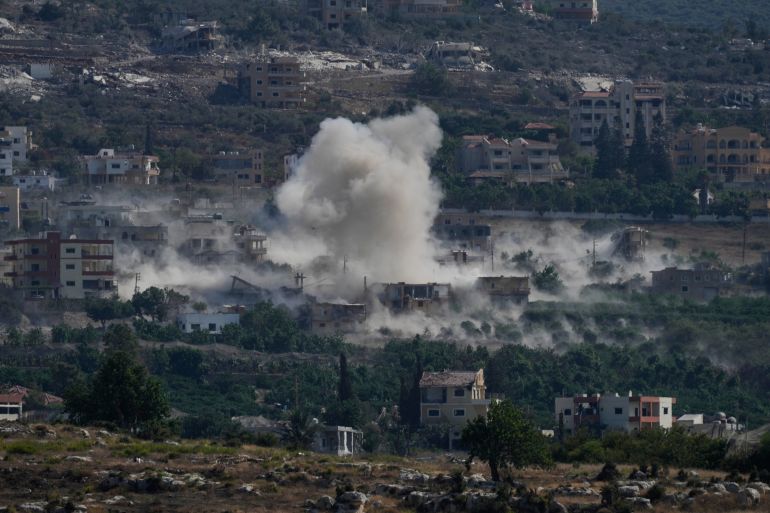 ap_6a99e2d50e9db-1788469973 Smoke rises as Israeli forces demolish homes in Mansouri village, southern Lebanon, Thursday, Sept. 3, 2026. (AP Photo/Mohammed Zaatari)