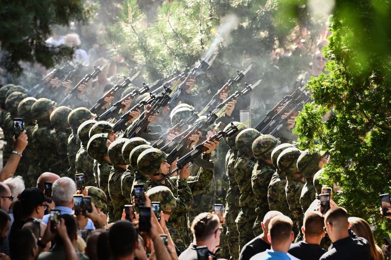 ap_6a9f0a4892199-1788807752 Serbian national military servicemen fire a three-volley salute during the funeral of former Bosnian Serb army commander Ratko Mladic, who died last week while serving a life sentence for genocide and other atrocities during the war in Bosnia, at the Topcider Cemetery, in Belgrade, Serbia, Monday, Sept. 7, 2026. (AP Photo)