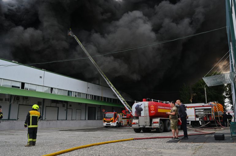 Firefighters put out a fire at warehouse stores after a Russian air attack in Odesa, Ukraine, Sunday, Sept. 13, 2026. (AP Photo/Michael Shtekel)