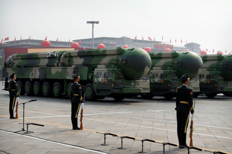 Chinese military vehicles carrying DF-41 ballistic missiles roll during a parade to commemorate the 70th anniversary of the founding of Communist China in Beijing, Tuesday, Oct. 1, 2019. Trucks carrying weapons including a nuclear-armed missile designed to evade U.S. defenses rumbled through Beijing as the Communist Party celebrated its 70th anniversary in power with a parade Tuesday that showcased China's ambition as a rising global force. (AP Photo/Mark Schiefelbein)