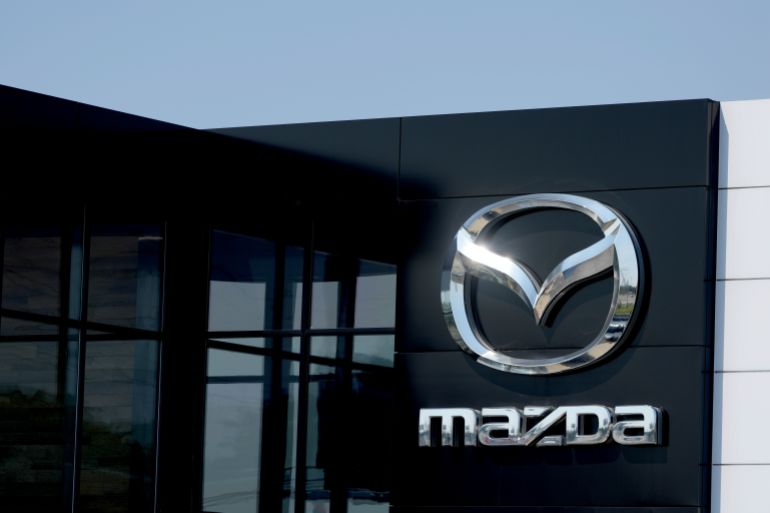 The entrance to a Mazda auto dealer is seen Thursday, Aug. 7, 2025, in Green Park, Mo. (AP Photo/Jeff Roberson)