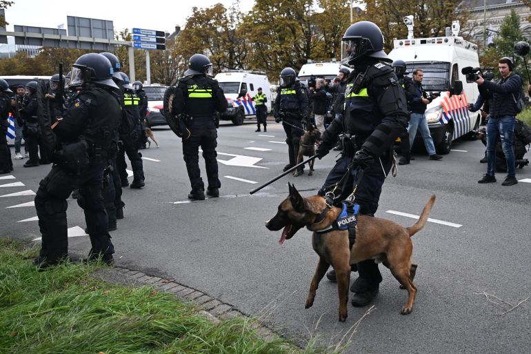 ap_6aaf7b74e3408-1789885300 A Police officer with a dog guards during a far-right groups' protest against immigration and asylum policies, in The Hague, Netherlands, Saturday, Sept. 19, 2026. (AP Photo/Mouneb Taim)