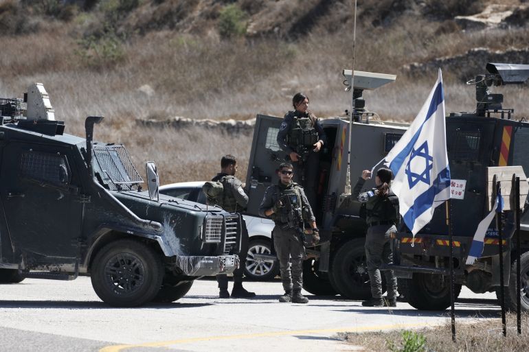 ap_6ab026c026bb6-1789929152 Members of the Israeli forces stand guard near the site of a shooting attack that, according to Israeli officials, killed one Israeli near the settlement of Neve Tzuf, north of the West Bank city of Ramallah, Sunday, Sept. 20, 2026. (AP Photo/Mahmoud Illean)