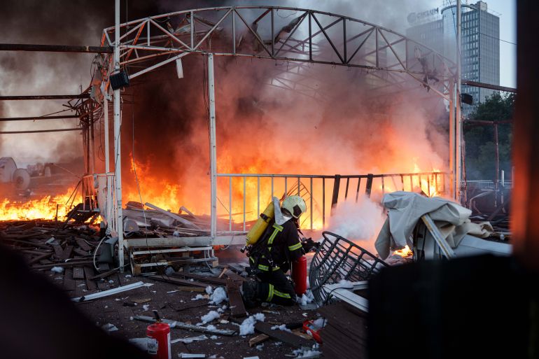ap_6ab7307cc7793-1790390396 A rescue worker puts out a fire on the roof of an office building damaged by a Russian drone strike, in Kyiv, Ukraine, Friday, Sept. 25, 2026. (AP Photo/Evgeniy Maloletka)