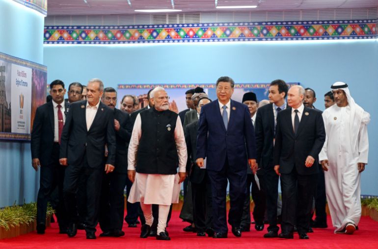 Participants, including Russia's President Vladimir Putin, China's President Xi Jinping, India's Prime Minister Narendra Modi and Iran's President Masoud Pezeshkian, walk during the BRICS summit in New Delhi, India, September 12, 2026. Sputnik/Kristina Solovyova/Pool via REUTERS ATTENTION EDITORS - THIS IMAGE WAS PROVIDED BY A THIRD PARTY.