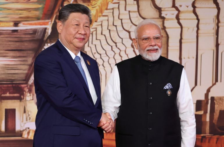 Indian Prime Minister Narendra Modi welcomes Chinese President Xi Jinping at the BRICS summit in New Delhi, India, September 12, 2026. Sputnik/Alexander Kazakov/Pool via REUTERS ATTENTION EDITORS - THIS IMAGE WAS PROVIDED BY A THIRD PARTY.
