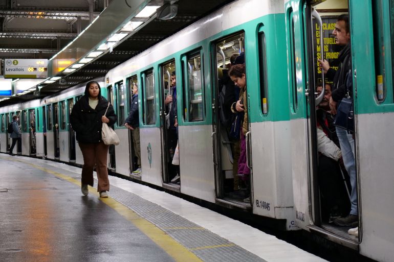 Passengers are seen at the Saint-Lazare metro station during the ninth day of national strike and protests in France against the government's pension reform, with heavy disruption on French SNCF railway and the Paris transport RATP networks, in Paris, France, March 23, 2023. REUTERS/Lucien Libert