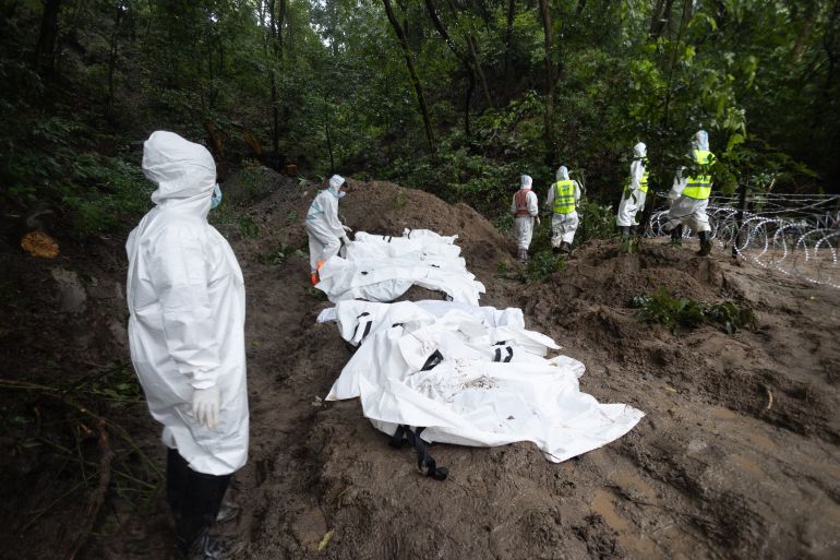 epa_6a97d9e6859c-1788336614 epa13204775 Army and police officers place the bodies of unidentified victims into a mass grave site at Dakshin Dhoka, Gokarneshwor, in Nepal, 01 September 2026, following a glacial flood near the Nepal-Tibet border. More than 1,000 people were killed, and thousands remain missing across northern Nepal after a glacial collapse and avalanche-triggered flash floods and mudslides along the Bhotekoshi and Trishuli river valleys near the Nepal-Tibet border, causing widespread destruction to settlements and infrastructure, according to the National Disaster Risk Reduction and Management Authority (NDRRMA). EPA/Suryams Upreti AUSTRALIA AND NEW ZEALAND OUT