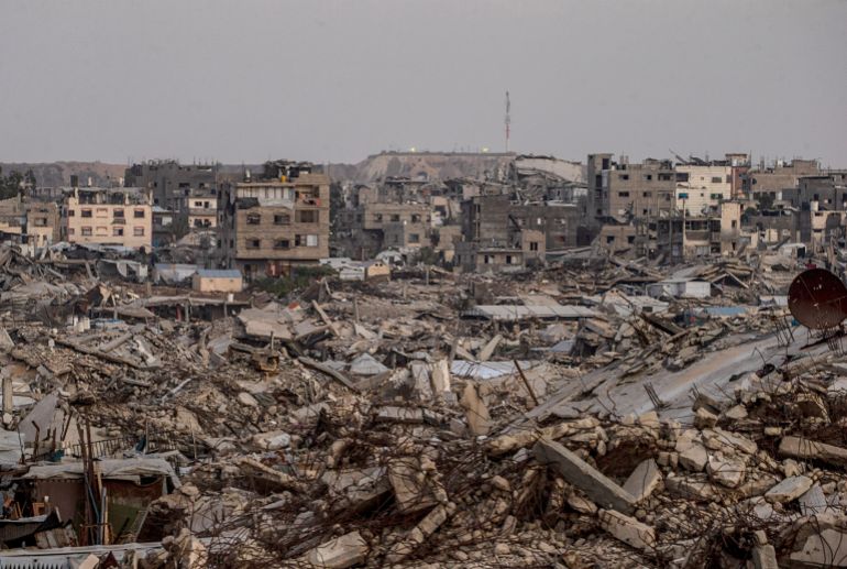 epa13230899 An Israeli military site is seen in the background behind destroyed residential buildings in the Al-Sheikh Radwan neighborhood, east of Gaza City, Gaza Strip, 10 September 2026 (issued 11 September 2026). Around 1.9 million people in Gaza, nearly 90 percent of the population, have been displaced since the Israel-Hamas conflict began in October 2023, according to the UN. EPA/MOHAMMED SABER