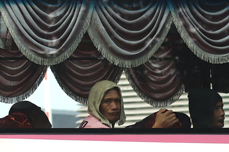 epa_6abbc84ab1a6-1790691402 epa13269754 A Myanmar national looks on from inside a bus at Manjung sports complex in Manjung, state of Perak, Malaysia, 29 September 2026. The first batch of the Voluntary Repatriation Programme involving 1,476 Myanmar nationals identified by Myanmar's government through a diplomatic note dated 13 August. EPA/FAZRY ISMAIL