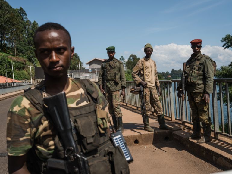 CYANGUGU, RWANDA - FEBRUARY 16: M23 rebel troops arrive at the Rusizi border post, joining the Congolese city of Bukavu with Cyangugu in Rwanda, on February 16, 2025 in Cyangugu, Rwanda. Militants from the Rwandan-backed M23 rebel group have entered Bukavu, the capital city of South Kivu province in the Democratic Republic of Congo (DRC). The city with a population of approximately one million people borders Rwanda on the southern end of Lake Kivu, positioned along a key trade route for the mineral-rich region. Hundreds of thousands of people in the eastern part of the DRC have been displaced as the rebel group has made swift advances against Congolese pro-government forces in recent weeks. (Photo by Hugh Kinsella Cunningham/Getty Images)