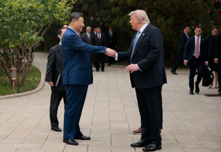 getty_6a6b2ba87f-1785408424 BEIJING, CHINA - MAY 15: U.S. President Donald Trump shakes hands with Chinese President Xi Jinping while leaving after a visit to the the Zhongnanhai Garden on May 15, 2026 in Beijing, China. Trump and other U.S. officials are finishing up a visit intended to address the Iran conflict, trade imbalances, and the Taiwan situation while establishing new bilateral boards for economic and AI oversight. (Photo by Evan Vucci-Pool/Getty Images)