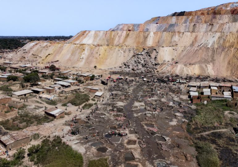 getty_6a97f90e9d-1788344590 KOLWEZI, DEMOCRATIC REPUBLIC OF CONGO - MAY 26: An aerial view shows artisanal miners working in harsh conditions at a cobalt and copper site on May 26, 2025 near Kolwezi, Democratic Republic of Congo. The vast, unregulated digging has severely altered the landscape, leading to widespread environmental degradation. In some areas, mining activities encroach on nearby communities, threatening homes, farmland, and access to clean water. (Photo by Michel Lunanga/Getty Images)
