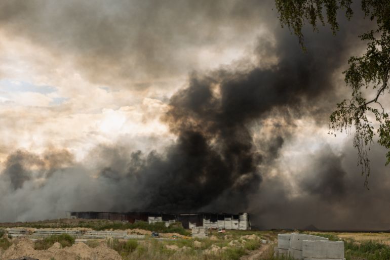 KYIV, UKRAINE - AUGUST 27: A view of smoke rising from the warehouse following a Russian drone strike in Boryspil district on August 27, 2026 in Kyiv, Ukraine. Drones hit a warehouse and home, while others were intercepted. The Ukrainian Air Force had earlier detected ballistic missiles heading toward the Ukrainian capital. (Photo by Diego Fedele/Getty Images)
