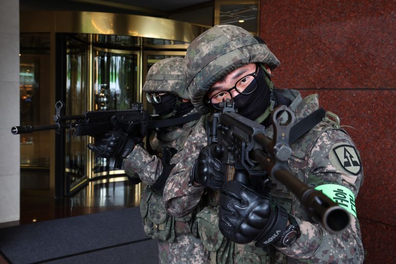 getty_6a9db9eadd-1788721642 SEOUL, SOUTH KOREA - AUGUST 19: South Korean soldiers participate in an anti-terrorism exercise, linked to the ongoing joint military drills known as Ulchi Freedom Shield (UFS) at Lotte Hotel World on August 19, 2026 in Seoul, South Korea. The exercise serves as a platform for the South Korean government to prepare for potential emergencies on the Korean Peninsula, with some 580,000 officials and military from about 4,000 city, county and ward governments, public institutions and others across the nation participating. (Photo by Chung Sung-Jun/Getty Images)