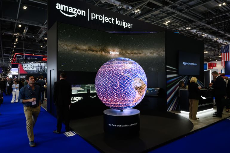 getty_6a9fe6935b-1788864147 LONDON, ENGLAND - SEPTEMBER 10: A display for Amazon's "Kuiper" low Earth orbit satellite broadband network is seen on day two of the Defence and Security Equipment International (DSEI) on September 10, 2025 in London, England. The DSEI hosts defence equipment manufacturers from around the world at a 4-day exhibition in London. During the event, anti-war protesters gathered outside the perimeter, in the hope of disrupting proceedings. (Photo by Leon Neal/Getty Images)