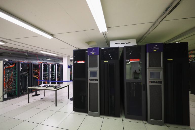 getty_6aafbdb91c-1789902265 MEYRIN, SWITZERLAND - APRIL 19: A general view in the CERN Computer / Data Centre and server farm of the 1450 m2 main room during a behind the scenes tour at CERN, the World's Largest Particle Physics Laboratory on April 19, 2017 in Meyrin, Switzerland. Experiments at CERN generate colossal amounts of data (the LHC experiments produce over 30 petabytes of data per year). The Data Centre stores it, and sends it around the world for analysis. Archiving the vast quantities of data is an essential function at CERN. CERN has more than 130 Petabytes of stored data (the equivalent of 700 years of full HD-quality movies). CERN does not have the computing or financial resources to crunch all of the data on site, so in 2002 it turned to grid computing to share the burden with computer centres around the world. The centre maintains disk and tape servers, which need to be upgraded regularly. (Photo by Dean Mouhtaropoulos/Getty Images)