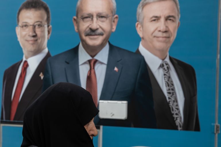 getty_6ab3dfa5b7-1790173093 ISTANBUL, TURKEY - MAY 09: A woman walks past a poster showing the portrait of Kemal Kilicdaroglu, presidential candidate of the Main Opposition alliance, and vice presidential candidates Ekrem Imamoglu and Mansur Yavas on May 09, 2023 in Istanbul, Turkey. On May 14th, Turkey’s President Erdogan will face his biggest electoral test as the country goes to the polls in the country’s general election. Erdogan has been in power for more than two decades -- first as prime minister, than as president -- but his popularity has recently taken a hit due to Turkey’s ongoing economic crisis and his government’s handling of series of devastating earthquakes that struck the country’s southeast in early February, killing more than 50,000 people. Meanwhile, the political opposition has united around one candidate, Kemal Kilicdaroglu, who some polls indicate has an edge. (Photo by Burak Kara/Getty Images)