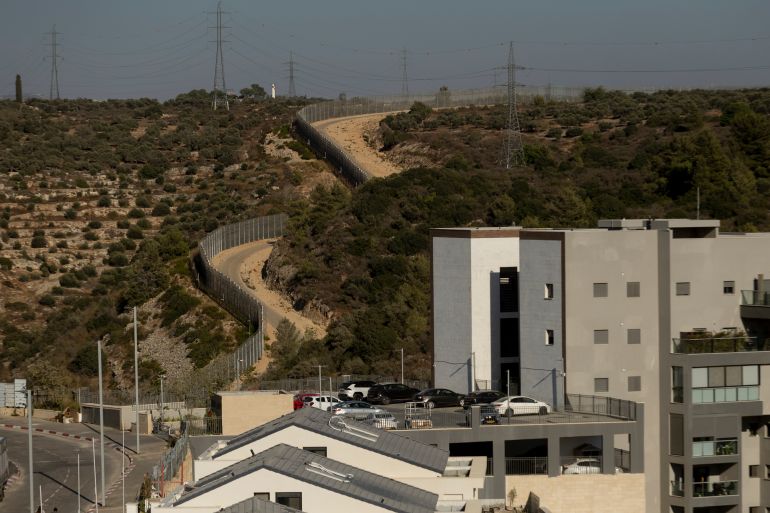 ALFEI MENASHE, WEST BANK - SEPTEMBER 9: An aerial view West Bank Separation Fence as seen from the Jewish settlement of Alfei Menashe in the West Bank on September 9, 2026 in Alfei Menashe, West Bank. In response to sanctions announced by UK Foreign Minister Ed Miliband on goods imported from illegal Israeli settlements in the occupied West Bank, Israel's Foreign Minister, Gideon Sa'ar, responded with a series of measures in retaliation. The most severe of those measures was to order the closure of the British consulate in Jerusalem, Britain's diplomatic mission to occupied Palestine. In a speech to the UK House of Commons on Tuesday, Miliband described Jewish settler activity in the occupied West Bank as "ethnic cleansing," and said that Israel's recent issuing of construction tenders in the area known as "E1" was crossing a "red line." (Photo by Amir Levy/Getty Images)