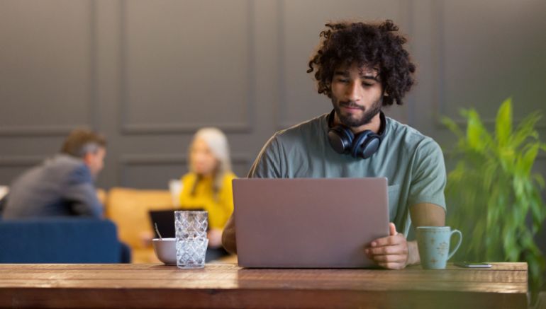 gettyimages-1152903936-1788886118 Creative businessman using laptop in co-working space - stock photo