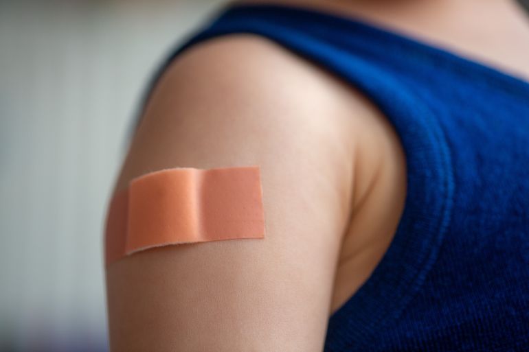gettyimages-2251763708-1789051304 SYMBOL - 26 May 2025, Berlin: A plaster sticks to the upper arm of a small child after a vaccination. Photo: Fernando Gutierrez-Juarez/dpa (Photo by Fernando Gutierrez-Juarez/picture alliance via Getty Images)