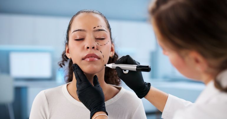 Expert Cosmetic Doctor Performing Aesthetic Surgery Treatment At Beauty Clinic.