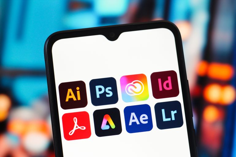 gettyimages-2256985389-1786303632 CANADA - 2026/01/22: In this photo illustration, the Adobe programs (Illustrator, Photoshop, Creative Cloud, InDesign, Acrobat, Express, After Effects and Lightroom) logos are seen displayed on a smartphone screen. (Photo Illustration by Thomas Fuller/SOPA Images/LightRocket via Getty Images)