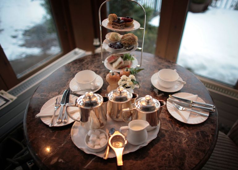gettyimages-84802024-1788188653 HARROGATE, ENGLAND - FEBRUARY 12: Afternoon tea for two at Bettys Tea Room, Harlow Carr on February 12, 2009 in Harrogate, England. The family owned company Taylors of Harrogate have been producing it's blends of teas and coffee since 1886 and serving it's products at the famous and traditional Bettys Tea Shops. Despite recent increases in the price of tea and the surge of coffee shops, the 'cuppa' is proving to be as popular as ever with bookings in Britain's discerning tea rooms being made weeks in advance. Consumption also increases during a recession as tea lovers take solace drinking tea. (Photo by Christopher Furlong/Getty Images)