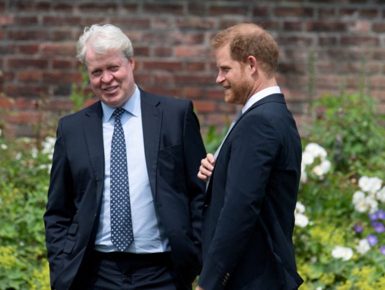 hary-wsbnsr-1789901424 FILE PHOTO: Britain's Prince Harry, Duke of Sussex, talks with his uncle Charles Spencer, 9th Earl Spencer, during the unveiling of a statue commissioned of his mother Diana, Princess of Wales, in the Sunken Garden at Kensington Palace, London, Britain July 1, 2021. Dominic Lipinski/Pool via REUTERS/File Photo