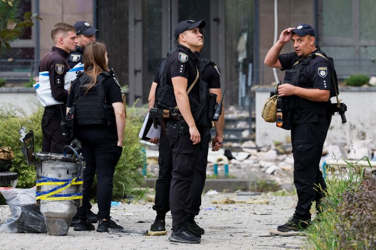 reuters_6a9a6bd8-1788505048 Police officers stand next to a part of a Russian drone, at the site of an apartment building damaged by a Russian drone strike, amid Russia's attack on Ukraine, in Kyiv, Ukraine September 1, 2026. REUTERS/Gleb Garanich