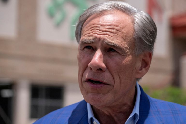FILE PHOTO: Texas Governor Greg Abbott speaks to reporters after casting his early vote in the state’s primary runoff election at a polling station in Austin, Texas, U.S. May 18, 2026. REUTERS/Joel Angel Juarez/File Photo